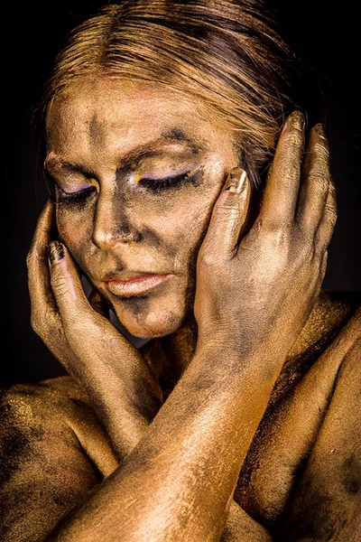 golden statue abstract body paint